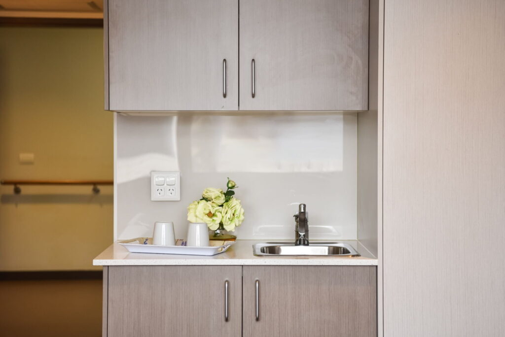 Ibis Care aged care Bexley single room kitchenette